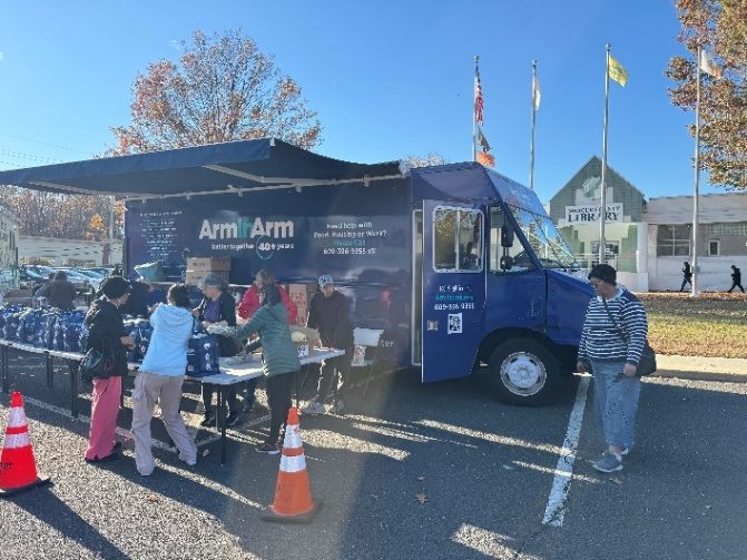 The Arm In Arm Mobile Pantry truck serving neighbors